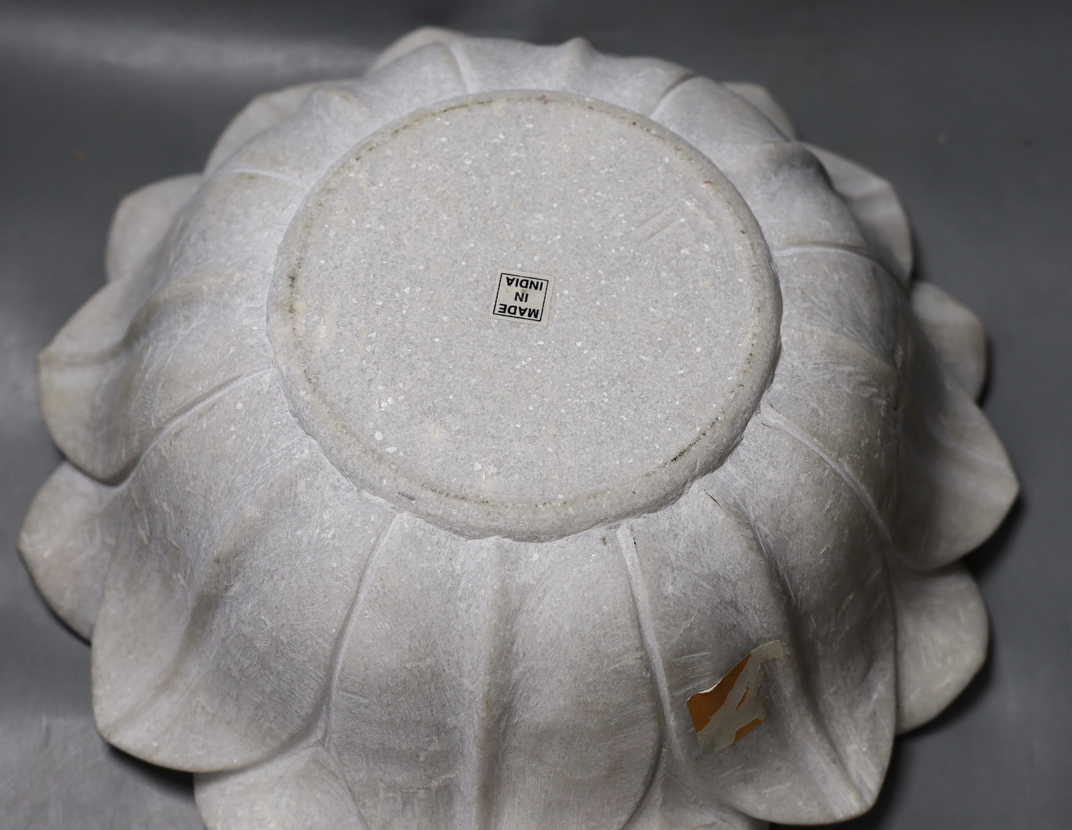 An Indian carved marble lotus flower bowl - 38cm diameter